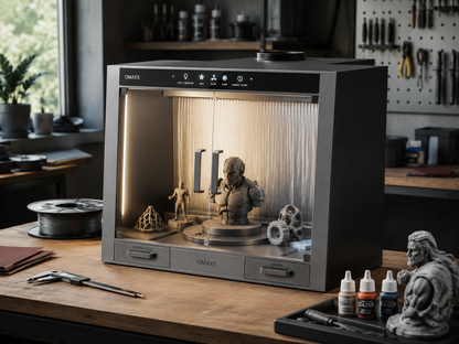Omaxs Finishing Station on a workbench with paint bottles and modeling tools